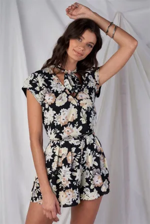 Black Multi Color Floral Print V-Neck Mini Sleeve Tight Fitted Waist Pleated Bottom Romper With Bow Tie Detail /1-2-2-1
