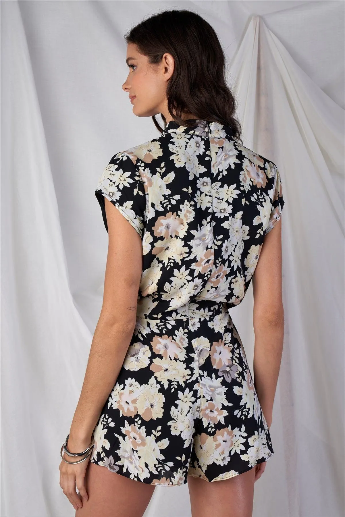 Black Multi Color Floral Print V-Neck Mini Sleeve Tight Fitted Waist Pleated Bottom Romper With Bow Tie Detail /1-2-2-1